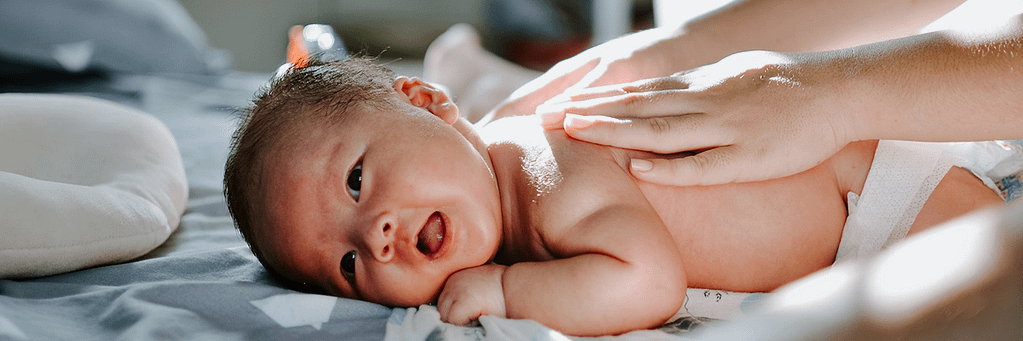 Doula teaching infant massage
